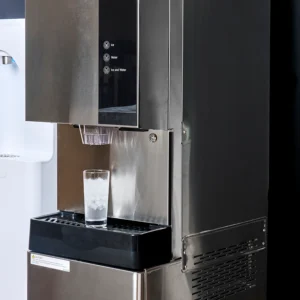 980-30 freestanding water and ice dispensers in a break room with glass of ice water